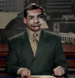 A person in a suit sitting at a table Description automatically generated with medium confidence A person in a suit sitting at a table Description automatically generated with medium confidence