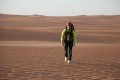 A person walking in the desert  Description automatically generated with medium confidence